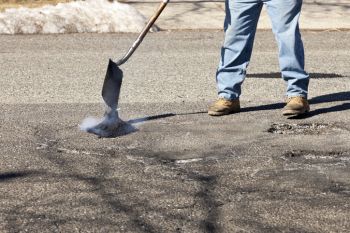 Pothole Filling in Wheaton, Missouri by Mullen's Asphalt Paving